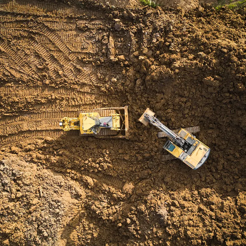 Heavy equipment on dirt construction site