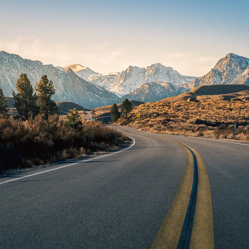 Curving highway near snowy mountains