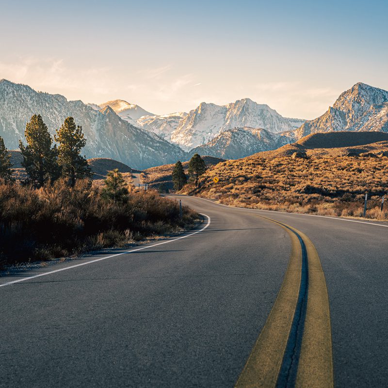Curving highway near snowy mountains