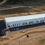 Industrial building surrounded by dirt roads