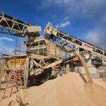Industrial conveyor system moving sand