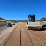 Road construction with roller machine