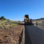 Road construction with asphalt paving machine