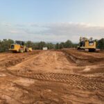 Construction site with excavator and loader