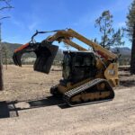 Caterpillar compact track loader with grapple