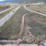 Aerial view of road construction beside highway